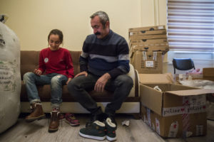 Turkish girl tries boots at mayor's office